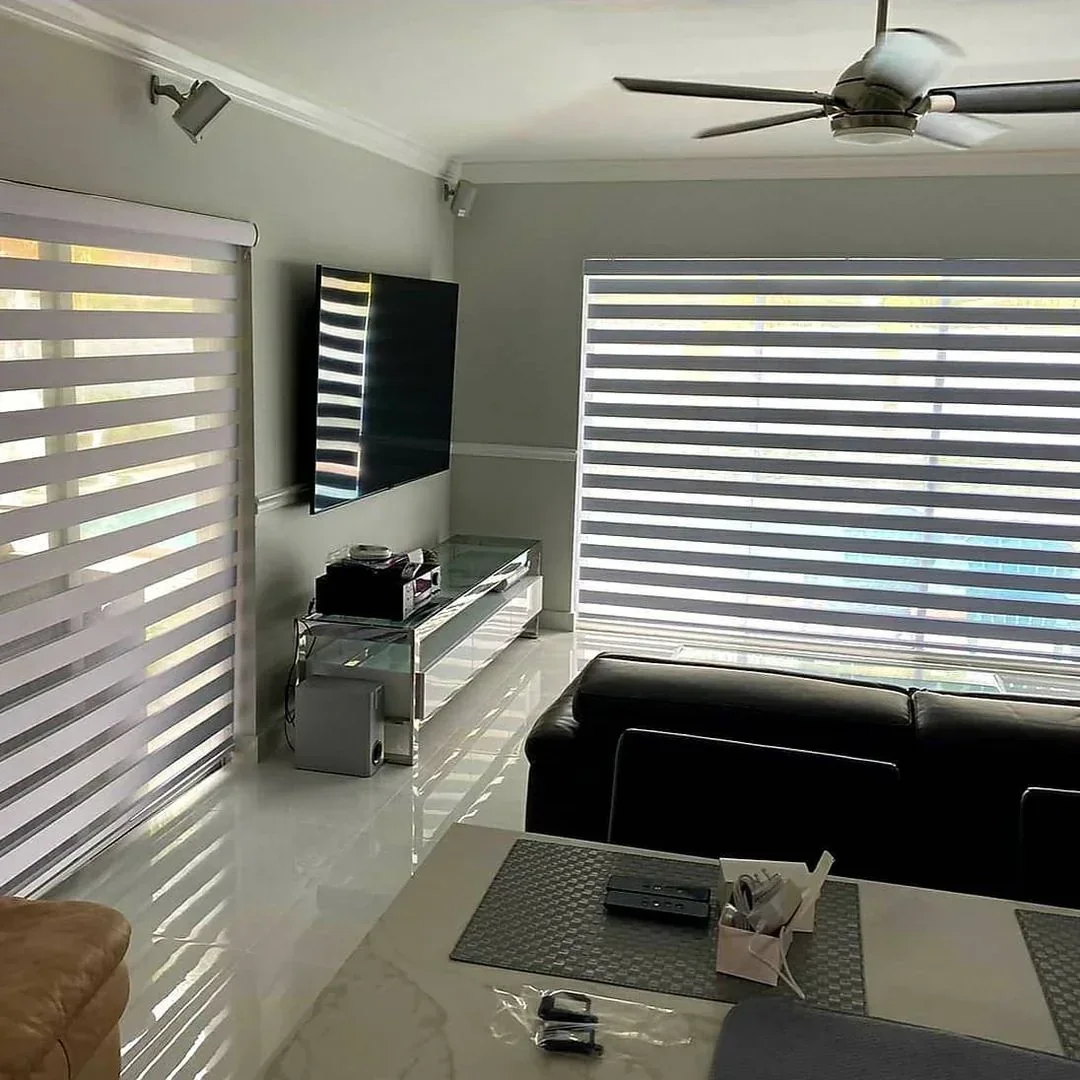 Custom zebra shades installed in a modern Miami living room