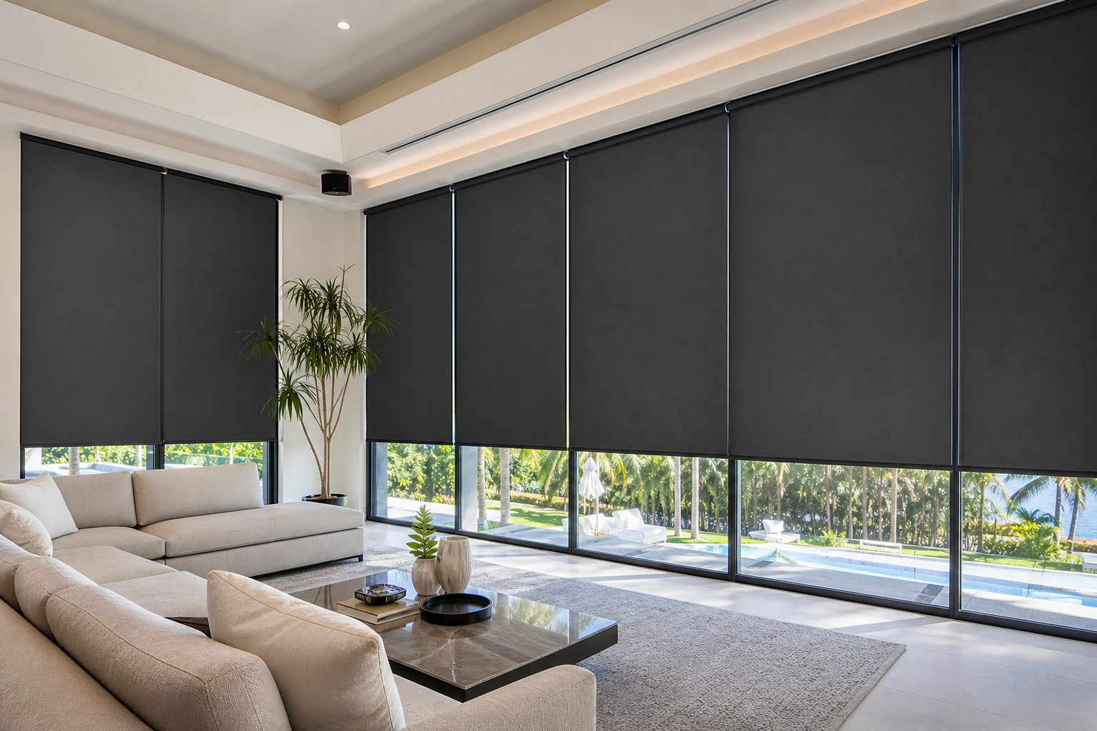 Custom blackout shades covering large floor-to-ceiling windows in a bright South Florida living room