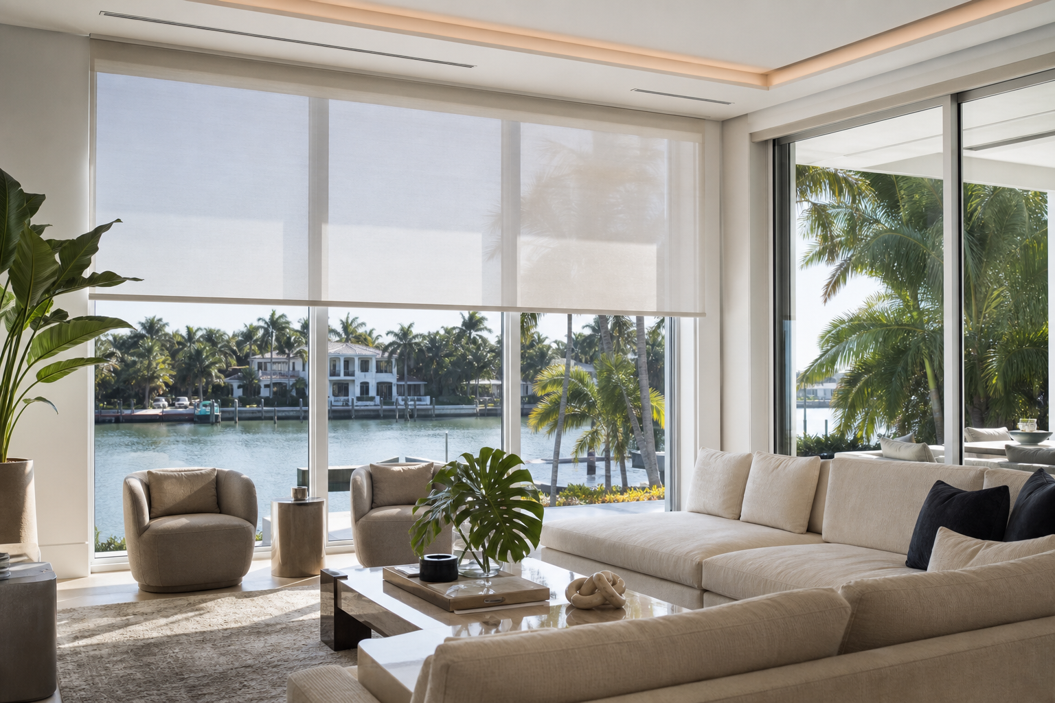 Modern South Florida living room with motorized roller shades filtering bright sunlight through large windows