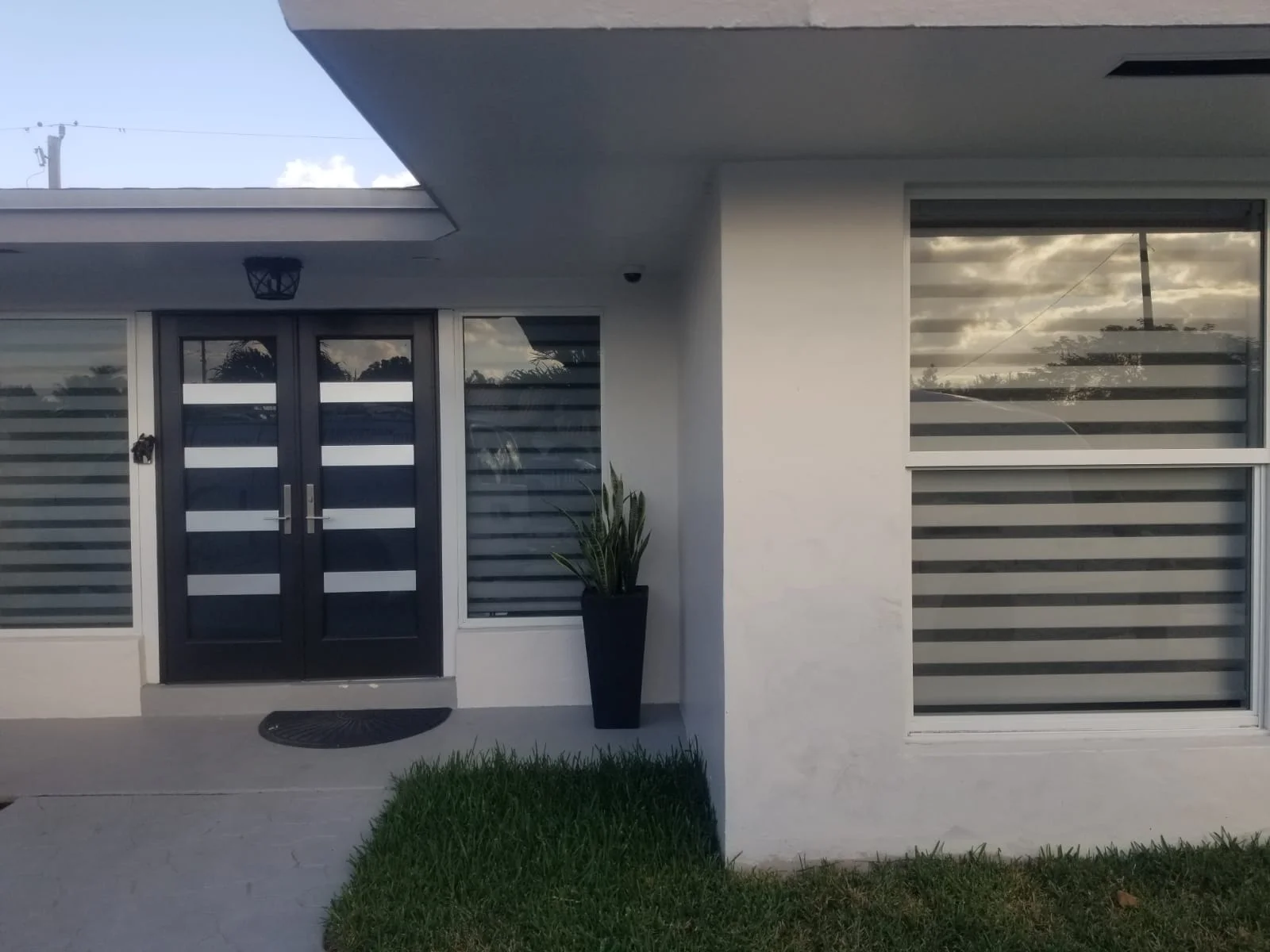 Custom blinds professionally installed across large windows